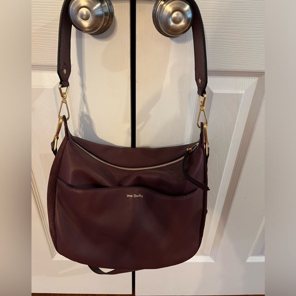 Vera Bradley leather/Suede crossbody/Shoulder Bag.Looks like a cranberry color.